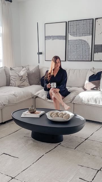 This gorgeous and modern black coffee table is everything. I